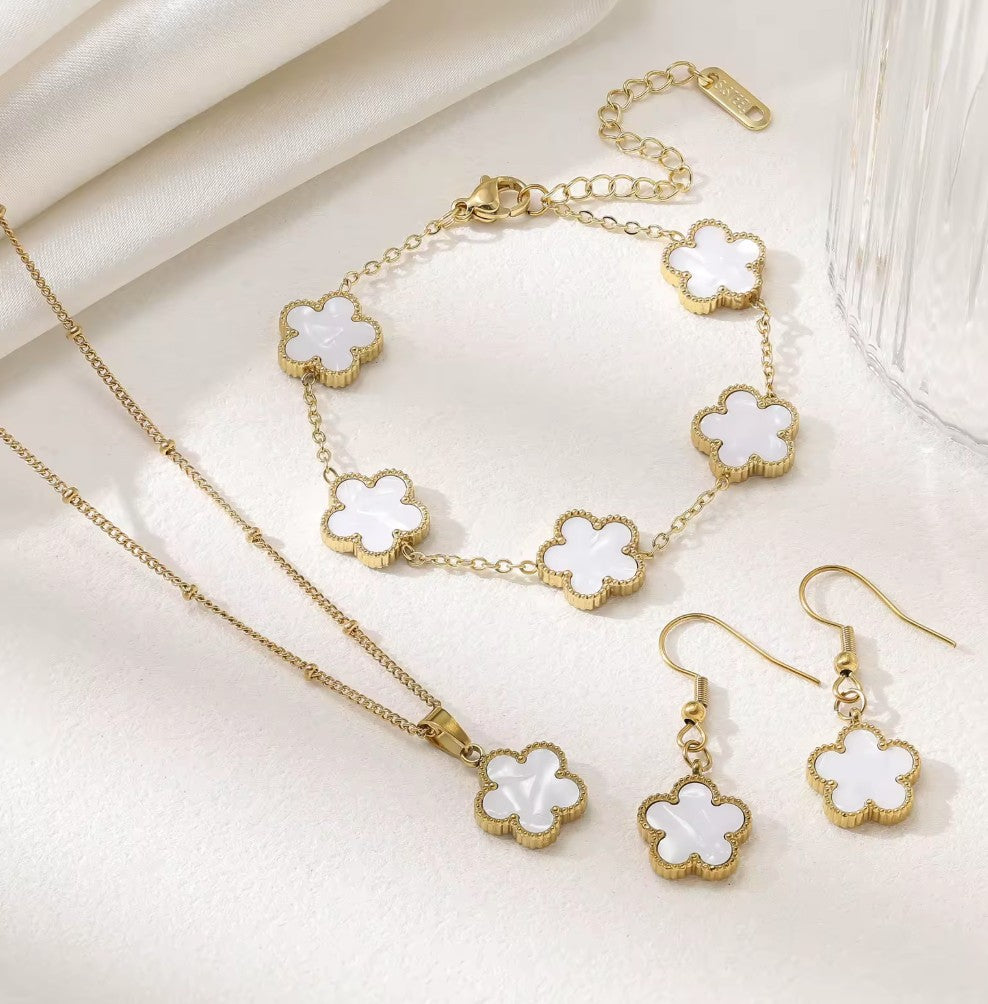 Aurelia Designs 3-piece jewellery set featuring white shell clover charms on 18k gold-plated stainless steel chains.